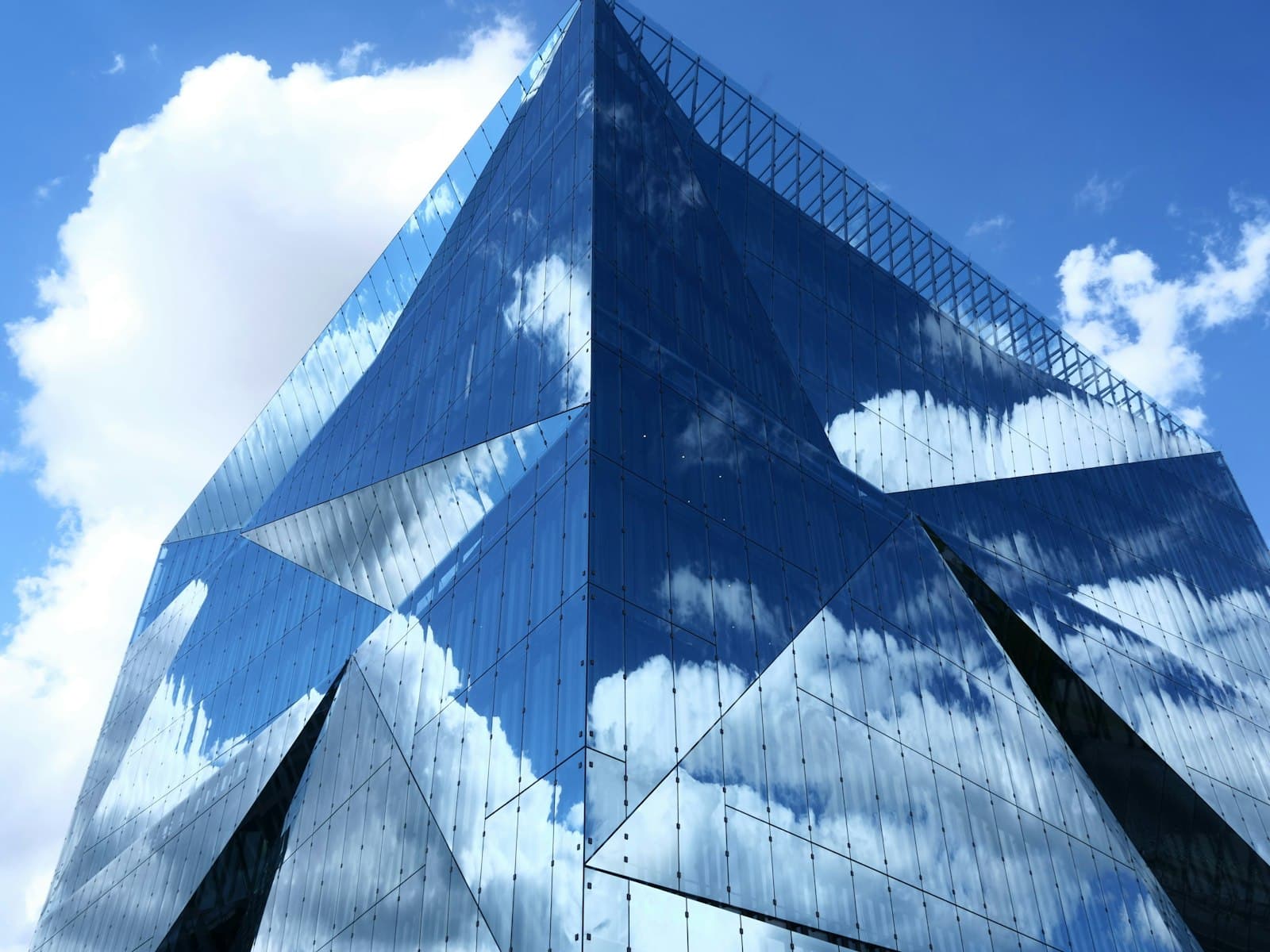 Angular glass building against a blue sky