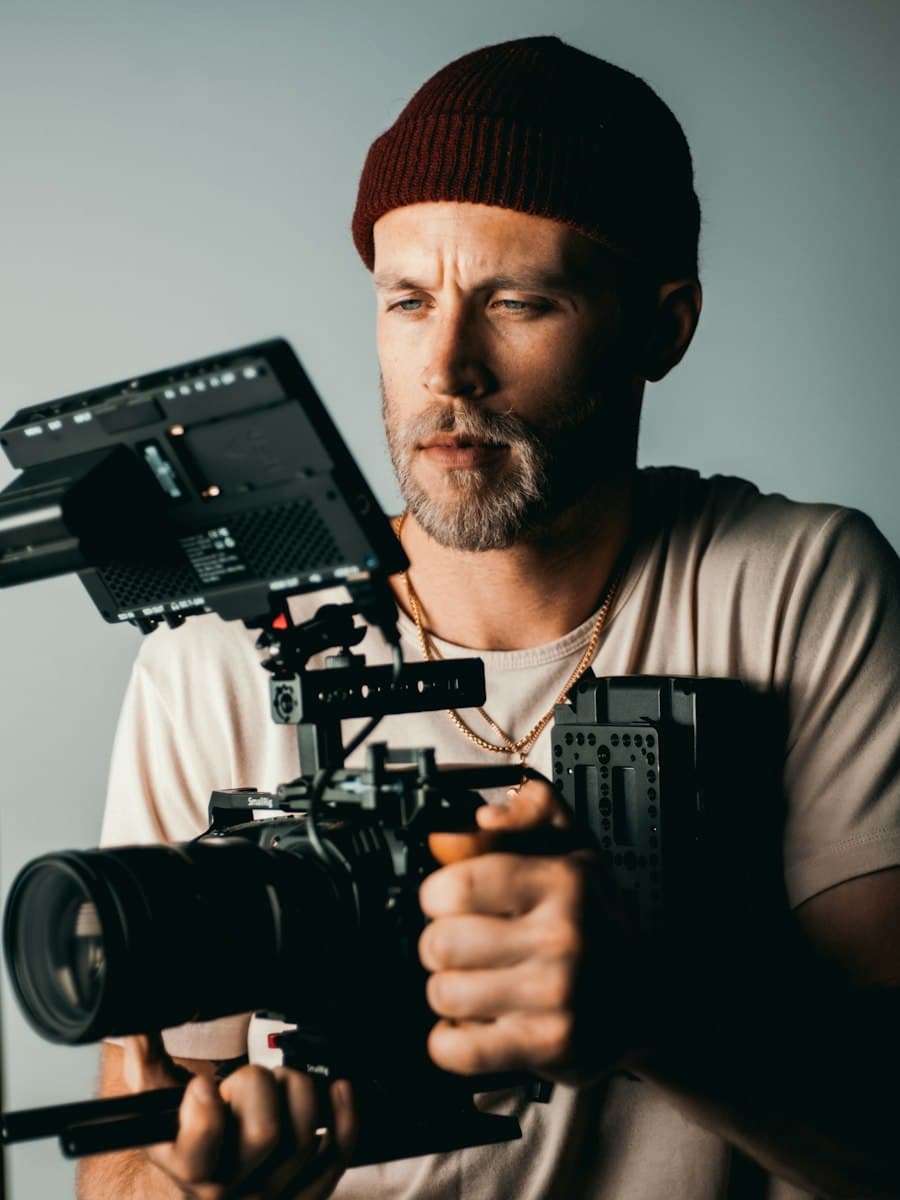 Videographer filming with a cinema camera rig
