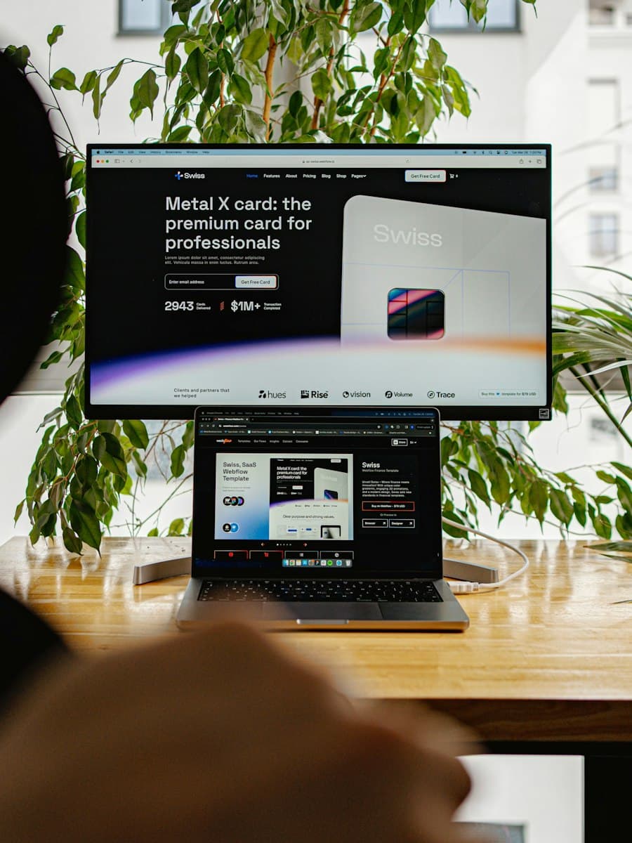 Desktop workspace showing a website on a large monitor