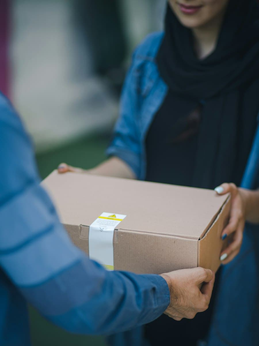 A parcel being handed to a customer